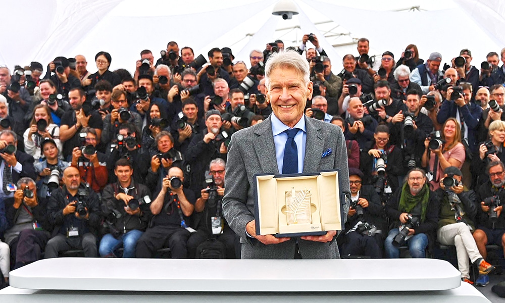 US actor Harrison Ford poses with his Honorary Palme d'Or during a photocall for the film 'Indiana Jones and the Dial of Destiny' at the 76th edition of the Cannes Film Festival in Cannes.—AFP