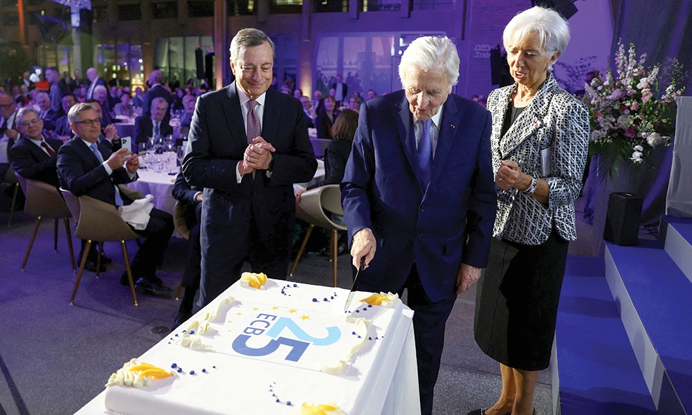 FRANKFURT: ECB President Christine Lagarde (right) and her predecessors, former ECB presidents Mario Draghi and Jean-Claude Trichet (center), cut a cake during celebrations of the European Central Bank ECB to mark its 25th anniversary at the ECB headquarters in Frankfurt am Main.- AFP