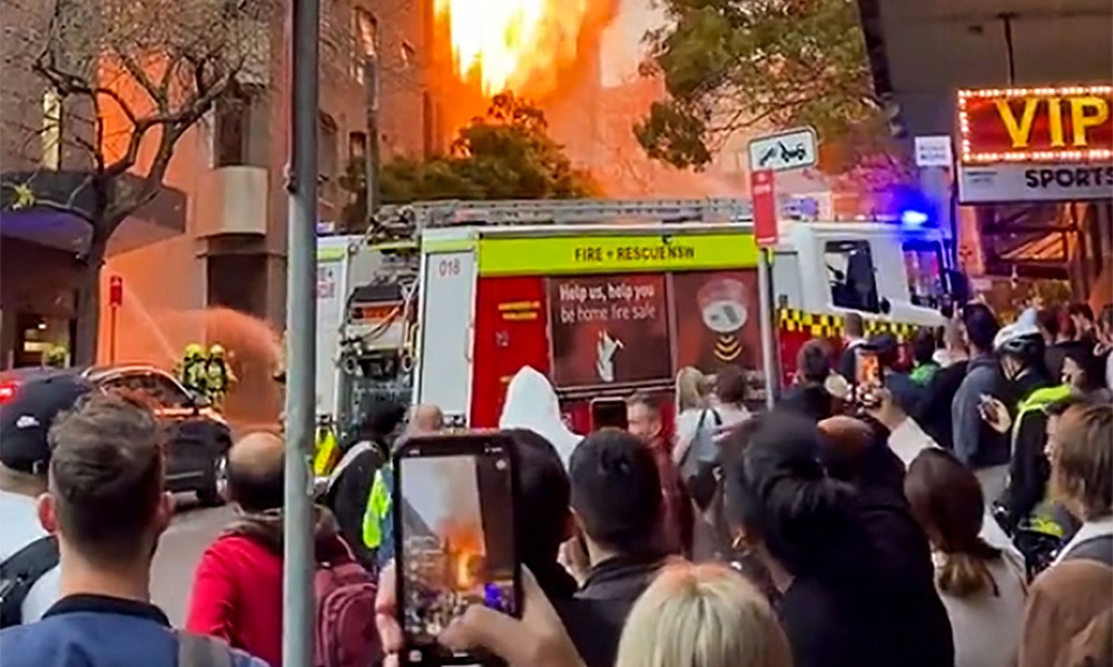SYDNEY: This screen grab from a video shows people watching a fire on May 25, 2023. – AFP