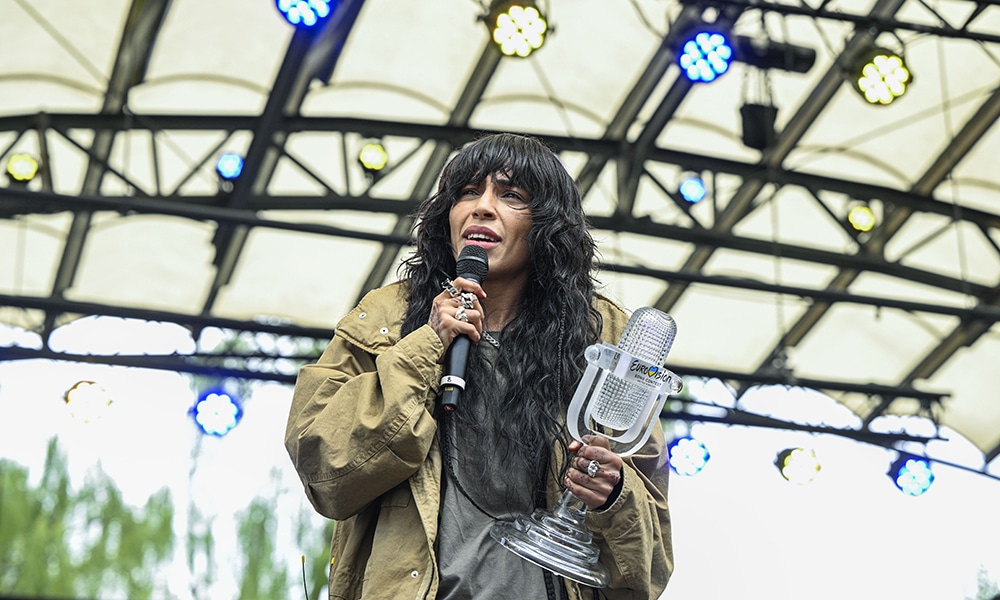 Eurovision Song Contest winner Swedish singer Loreen holds the ESC trophy on stage to celebrate with fans at the Kungstradgarden park in Stockholm, Sweden.