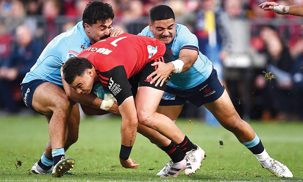 CHRISTCHURCH: Crusaders’ David Havili (center) is tackled by the Waratahs’ Mosese Tuipulotu (right) and Charlie Gamble during the round 14 Super Rugby Pacific match between the Crusaders and the New South Wales Waratahs on May 27, 2023. – AFP