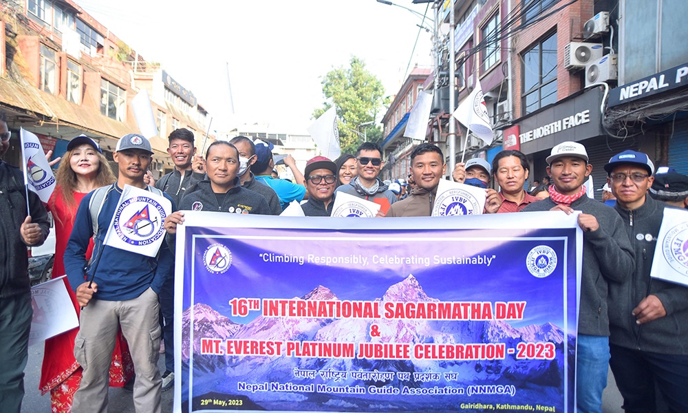 Nepali people take part in a procession to mark the 16th International Everest Day.