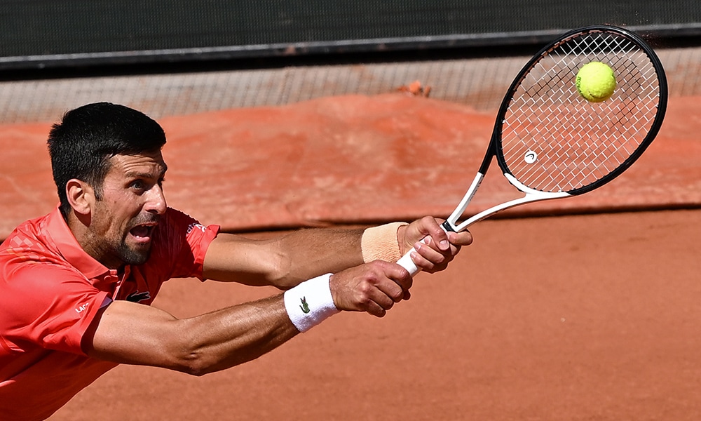 PARIS: Serbia’s Novak Djokovic plays a backhand return to US Aleksandar Kovacevic during their men’s singles match on day two of the Roland-Garros Open tennis tournament at the Court Philippe-Chatrier in Paris.- AFP