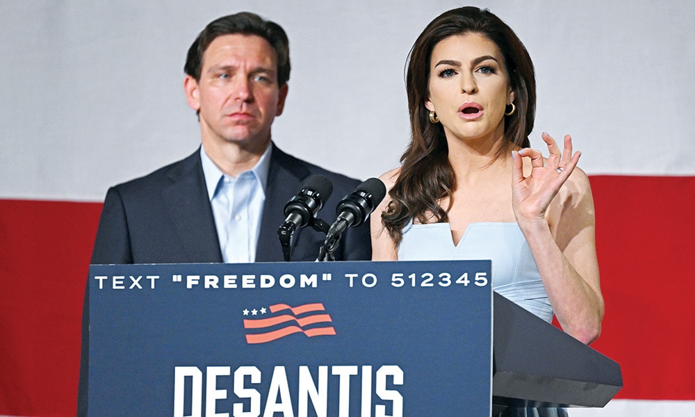 CLIVE: Florida Governor and 2024 Presidential hopeful Ron DeSantis (L) listens as his wife Casey DeSantis speaks during his campaign kickoff event at Eternity Church in Clive, Iowa. – AFP