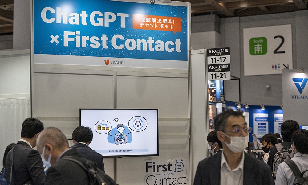 TOKYO: Visitors look at a booth showing ‘FirstContact’, a problem-solving AI-equipped chatbot service by Japanese company Vitalify using ChatGPT, during the three-day 7th AI Expo, part of NexTech Week Tokyo 2023.- AFP