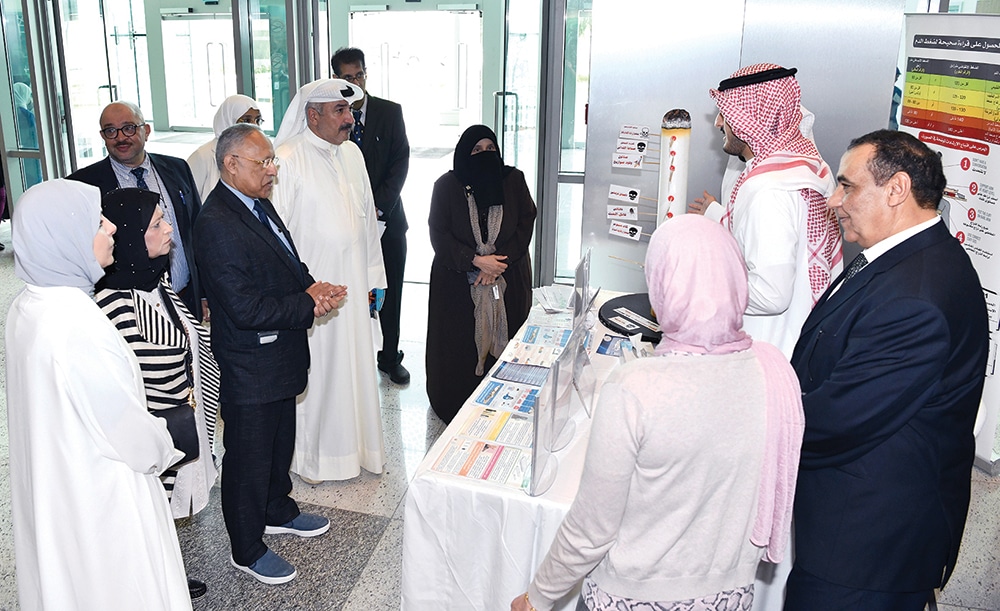 KUWAIT: Officials tour booths at the event held by the health ministry on the occasion of “World No Tobacco Day”. -- KUNA photos