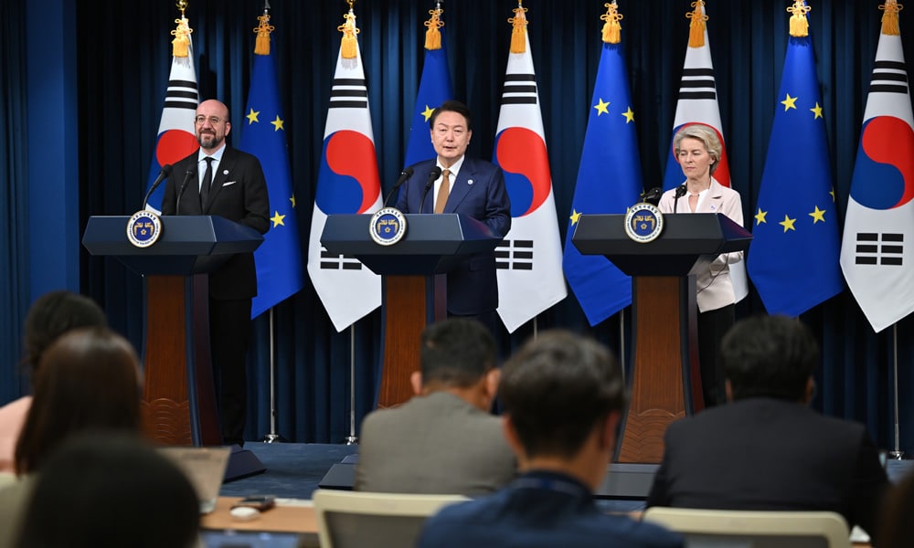 South Korea's President Yoon Suk Yeol (C) speaks as Charles Michel (L), President of the European Council, and Ursula von der Leyen (R), President of the European Commission, look on during a joint press briefing after their meeting at the Presidential Office in Seoul on May 22, 2023.