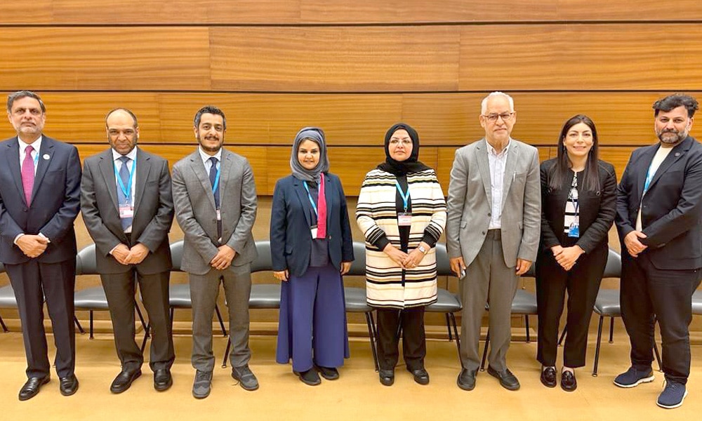 Dr. Buthaina Al-Mudhaf and a number of participants.