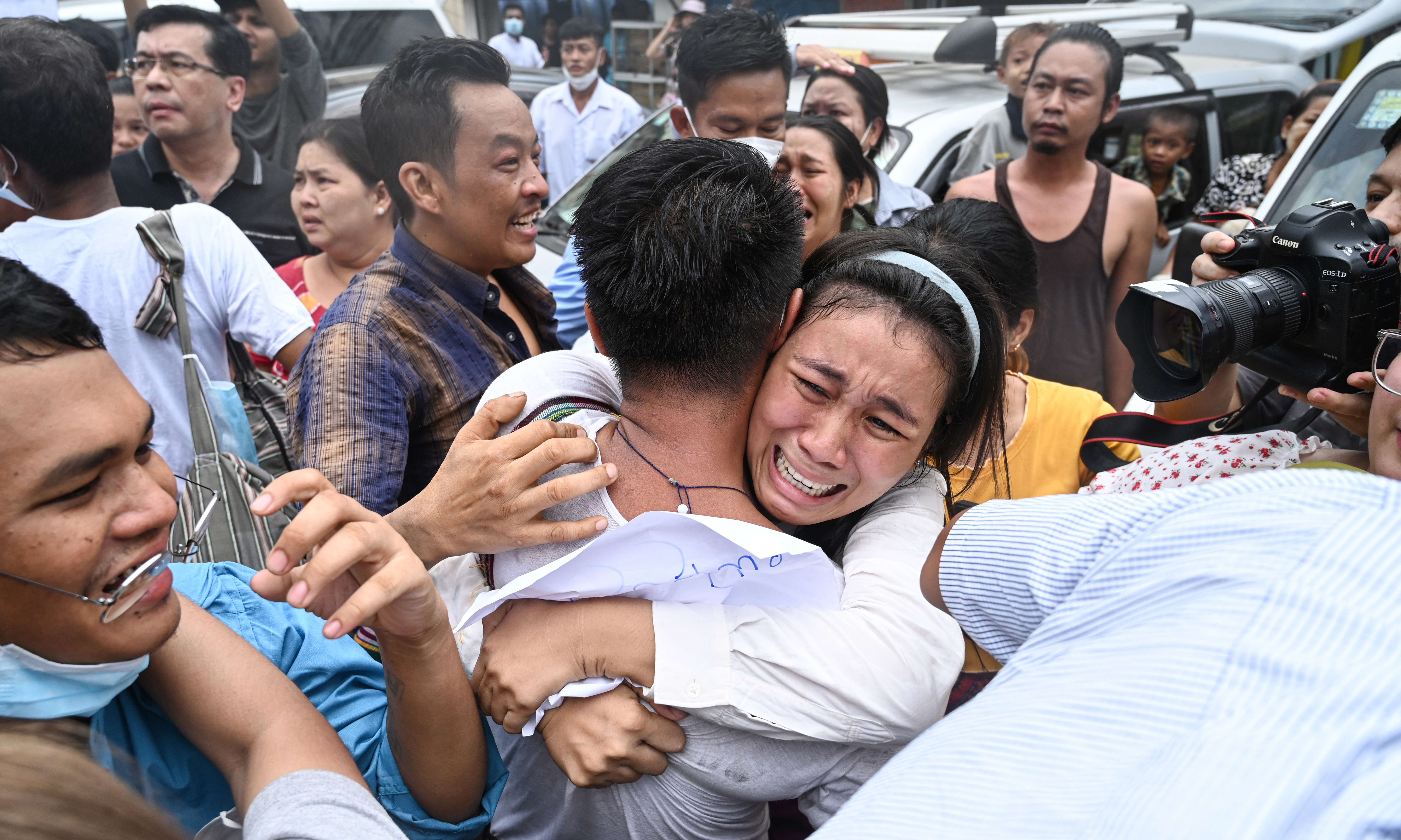 YANGON: A man celebrates with a relative after being released from Insein Prison in Yangon on May 3, 2023. Myanmar’s junta announced it had pardoned 2,153 prisoners jailed under a law that criminalises encouraging dissent against the military. – AFP