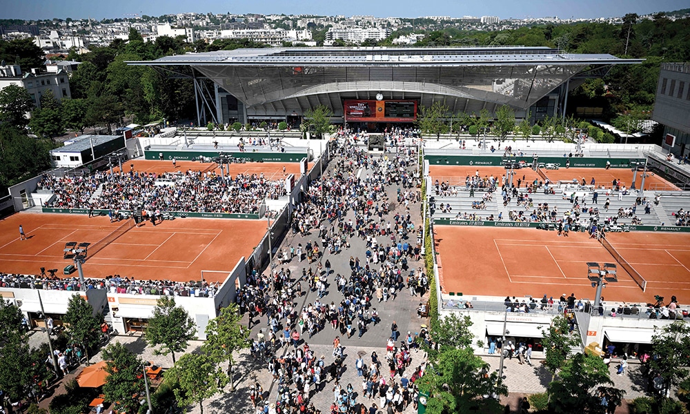 PARIS: Spectators walk in front of the Court Susan Lenglen ahead of the start of the Roland-Garros Open tennis tournament in Paris on May 27, 2023. —AFP