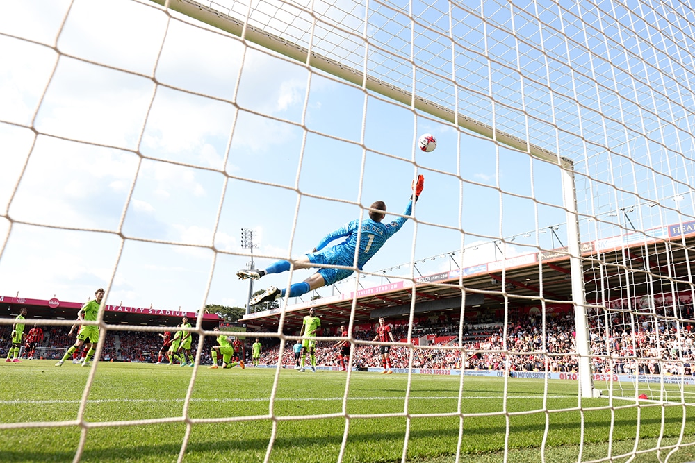 BOURNEMOUTH: Manchester United’s Spanish goalkeeper David de Gea jumps to stop the ball during the English Premier League football match between Bournemouth and Manchester United at the Vitality Stadium in Bournemouth, southern England on May 20, 2023. – AFP