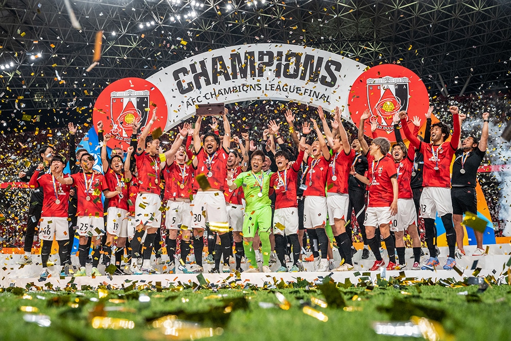 SAITAMA: Urawa Red Diamonds players celebrate with the trophy after their victory against Al-Hilal in the second leg of the AFC Champions League final at Saitama Stadium on May 6, 2023. - AFP