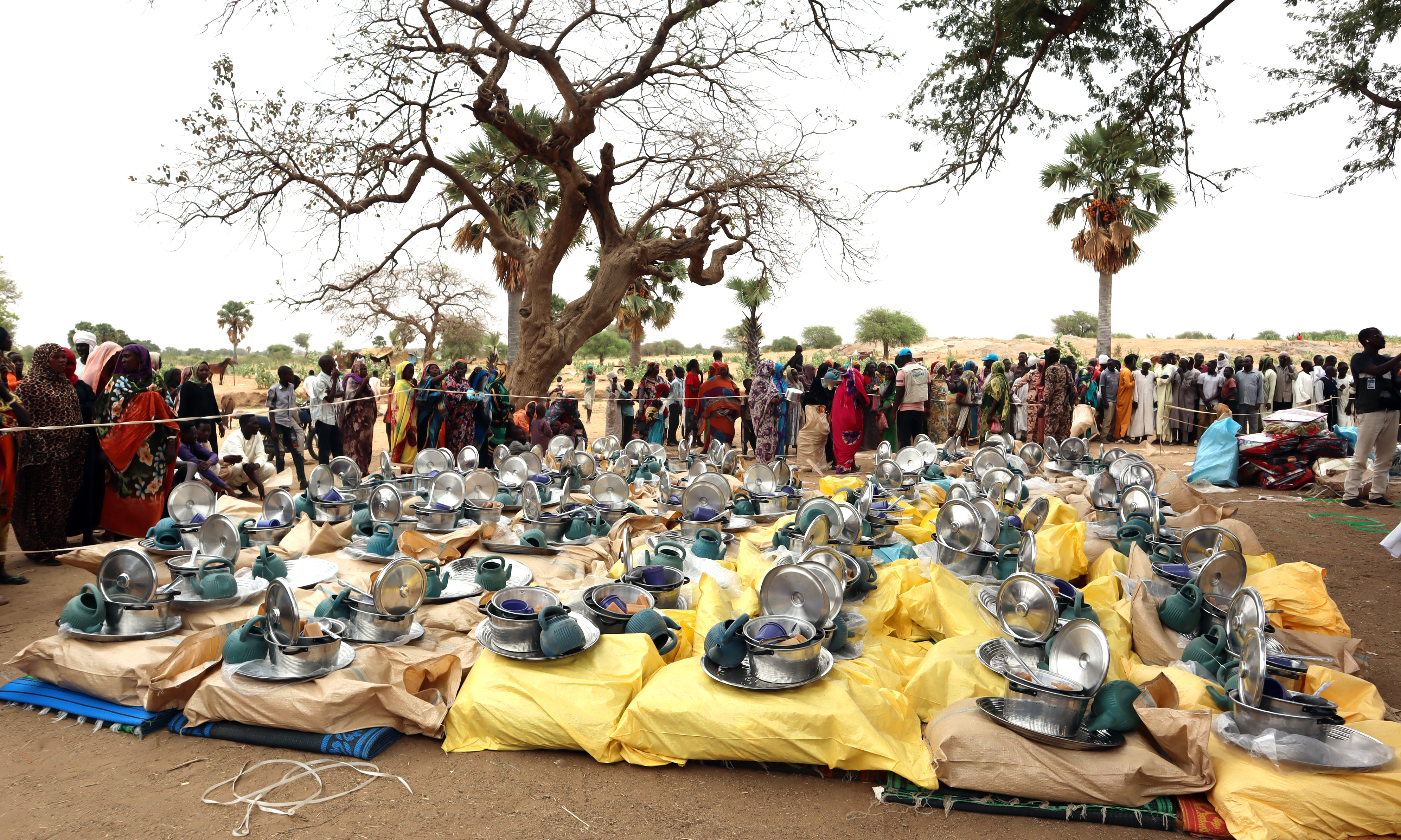 KOUFROUN: Aid kits destined to Sudanese refugees who crossed into Chad are prepared for distribution in Koufroun, near Echbara. – AFP