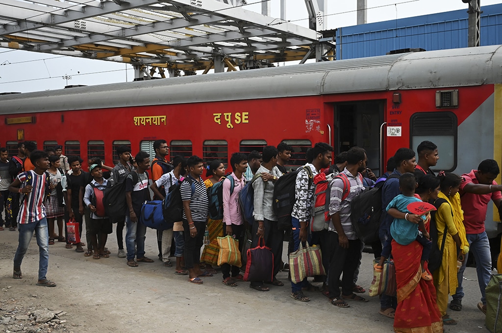 KOLKATA: Passengers queue along a platform to board the Chennai bound Coromandel Express at Shalimar station near Kolkata on June 7, 2023. – AFP