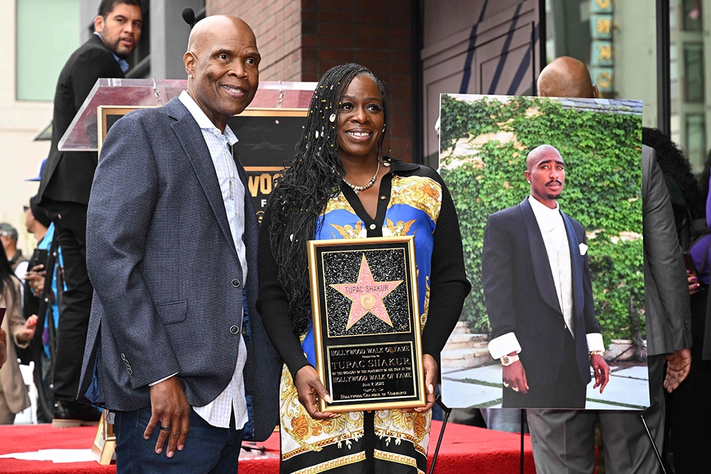 US radio personality Big Boy (left) and Sekyiwa Shakur, sister of US rapper Tupac Shakur, pose for a photo during Tupac's Hollywood Walk of Fame star ceremony in Hollywood, California. - AFP photos