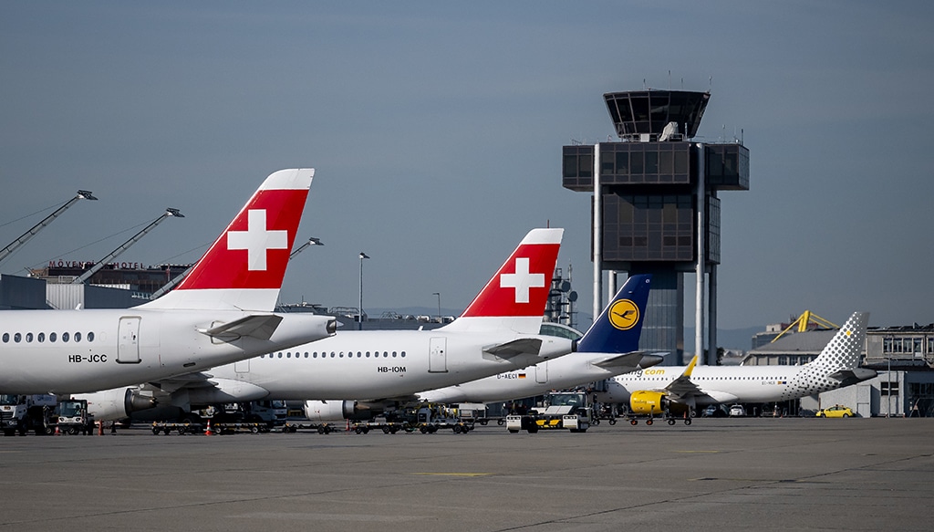GENEVA: Commercial planes of Swiss air lines, Lufthansa and Spanish low-cost airline Vueling are parked on the tarmac of Geneva Airport.- AFP