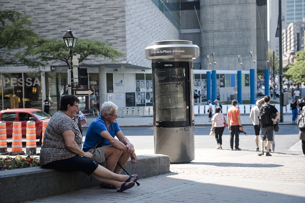 MONTREAL: Two people relax in the shade during a heatwave in Montreal, Quebec, Canada.- AFP