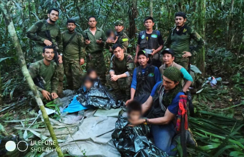 GUAVIARE, Colombia: Members of the Colombian army pose with four lost indigenous children who were found in the Amazon rainforest on June 9, 2023. – AFP