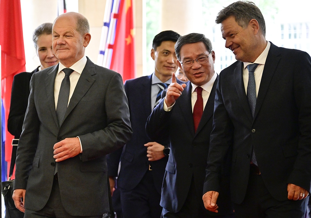 BERLIN: (L to R) German Chancellor Olaf Scholz, China's Premier Li Qiang and German Minister of Economics and Climate Protection Robert Habeck arrive for the German-Chinese Forum for Economic and Technological Cooperation in Berlin. – AFP