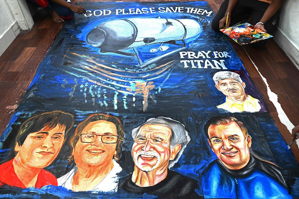 MUMBAI: Art school students give final touches on June 22, 2023 to a painting depicting five people aboard a submersible named Titan that went missing near the wreck of the Titanic. – AFP