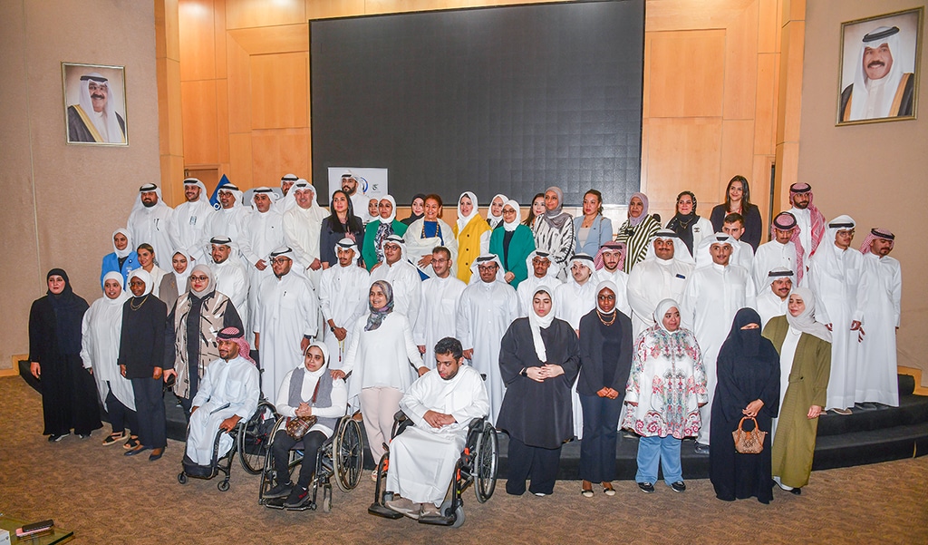 KUWAIT: Participants and officials pose for a photo at the final meeting for PADA's employment program. -- KUNA photos