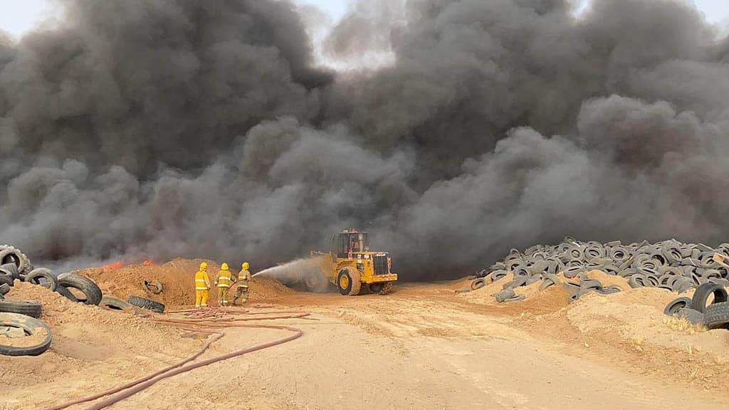 KUWAIT: Firemen battle a blaze at the Salmi tyre dump on June 2, 2023. — KUNA
