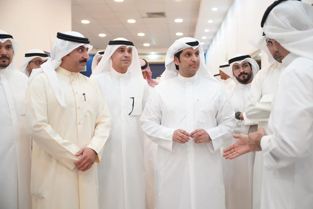 Minister of Information Abdulrahman Al-Mutairi is seen with officials during his tour of the media center and studios set for covering the vote counting process. - KUNA photos