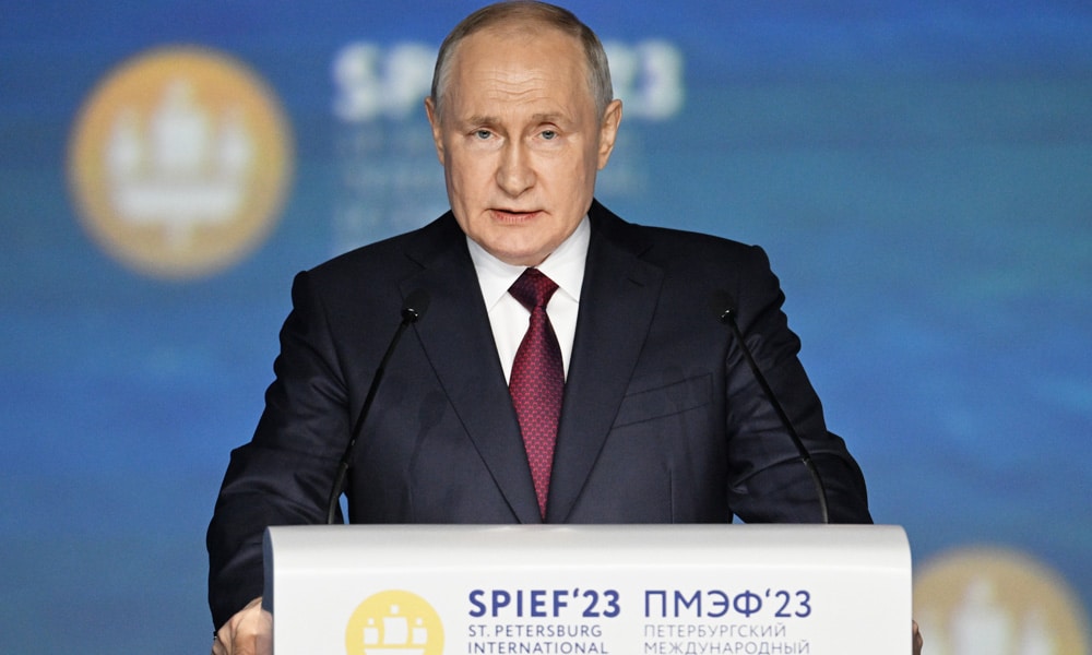 This handout picture taken on June 16, 2023 and released by host photo agency RIA Novosti shows Russian President Vladimir Putin giving a speech at a plenary session of the Saint Petersburg International Economic Forum (SPIEF) in Saint Petersburg.