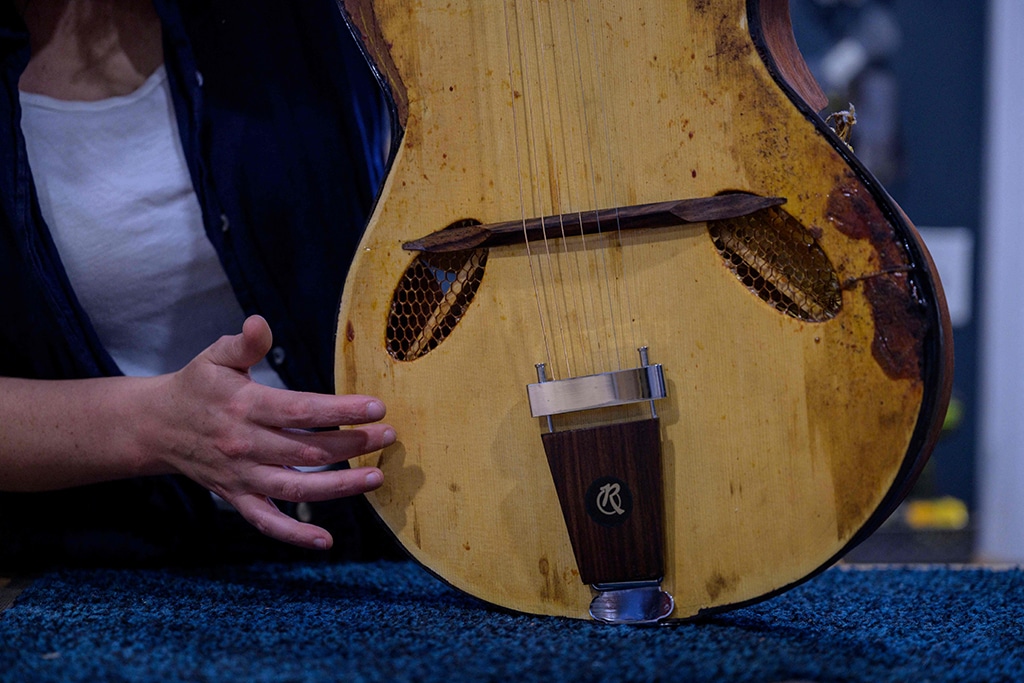 French luthier Rachel Rosenkrantz holds her 'Pawtuxet', a guitar made using honeycomb in her studio.