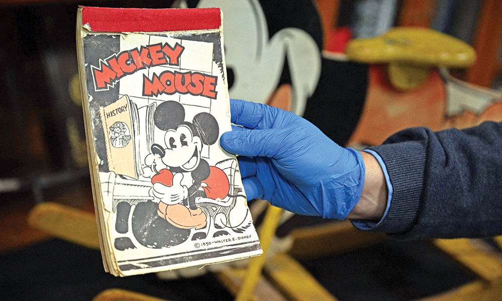An early Mickey Mouse notepad is displayed during a media tour of the Walt Disney Archives.