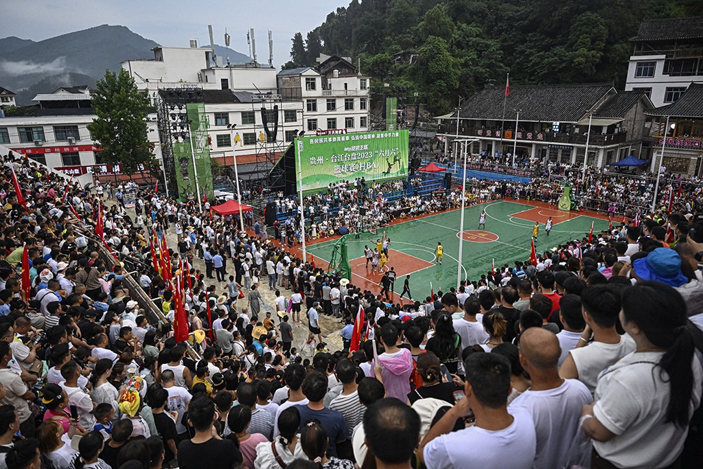 This photo shows a general view of spectators watching a game of the grassroots basketball competition CunBA in Taipan village, Taijiang county, in southwestern China's Guizhou province.