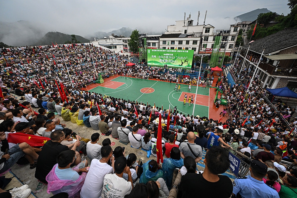 This photo shows a general view of spectators watching the grassroots basketball competition CunBA in Taipan village, Taijiang county, in southwestern China's Guizhou province.