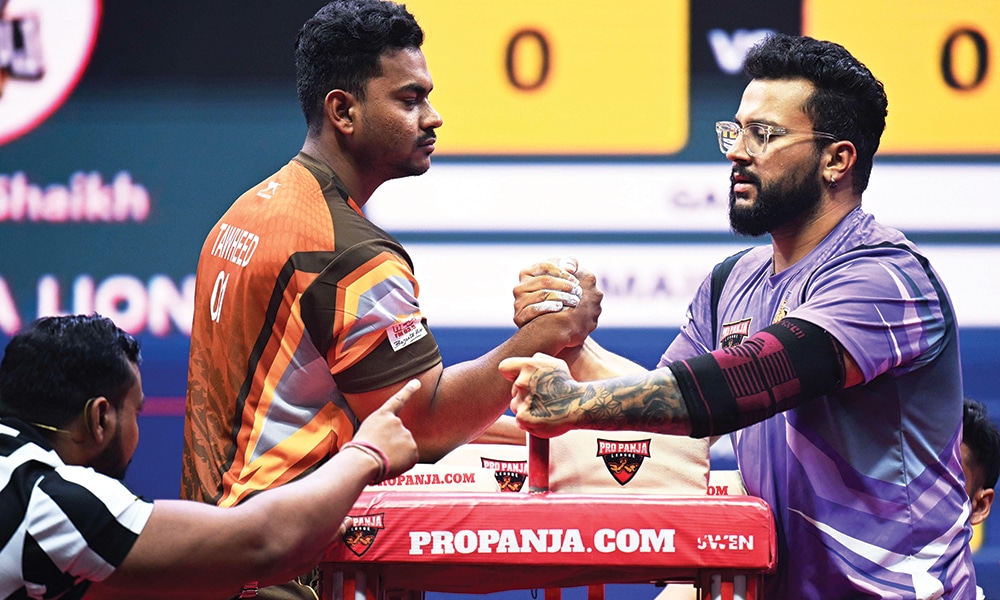 In this photograph taken on Aug 2, 2023, Harman Mann of Baroda Badshahs (right) competes against Tawheed Shaikh of Ludhiana Lions during the Pro Panja League 2023 in New Delhi.