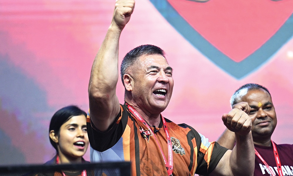 Coach of Ludhiana Lions Yerkin Alimzhanov reacts after winning a match.