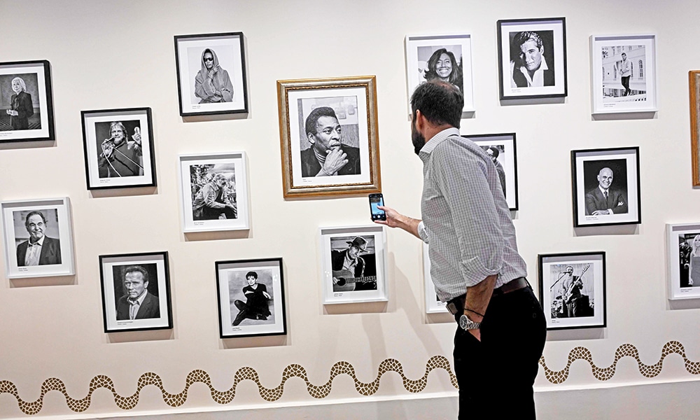 A man gets information using a QR code at the Hall of Fame of the Belmond Copacabana Palace Hotel.