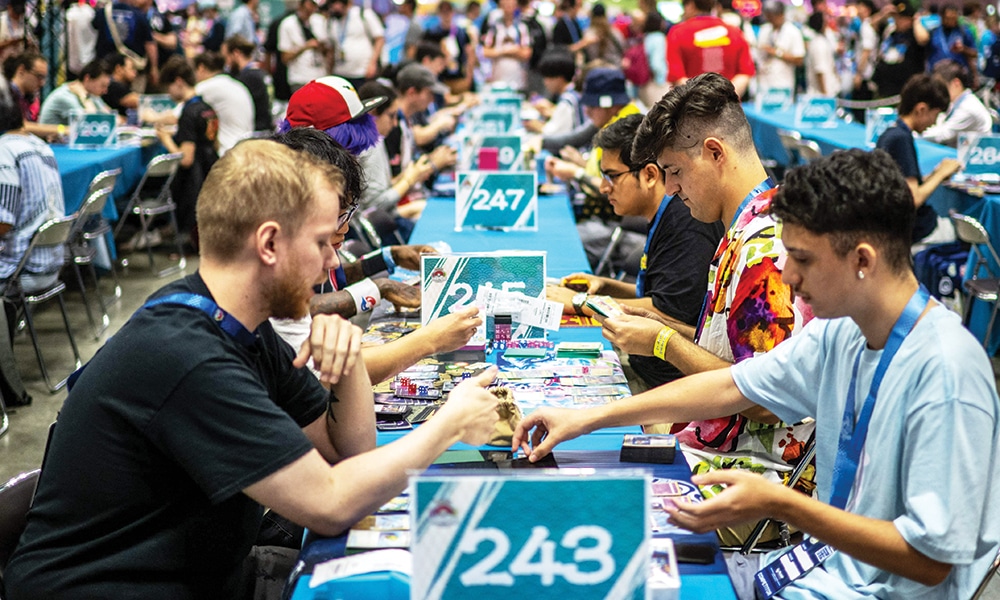 Competitors take part in the trading card game at the 2023 Pokemon World Championships.