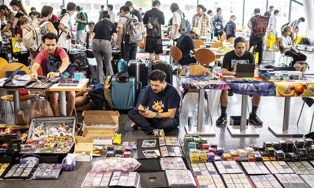 Pokemon fans display cards and products at the dedicated trade area.