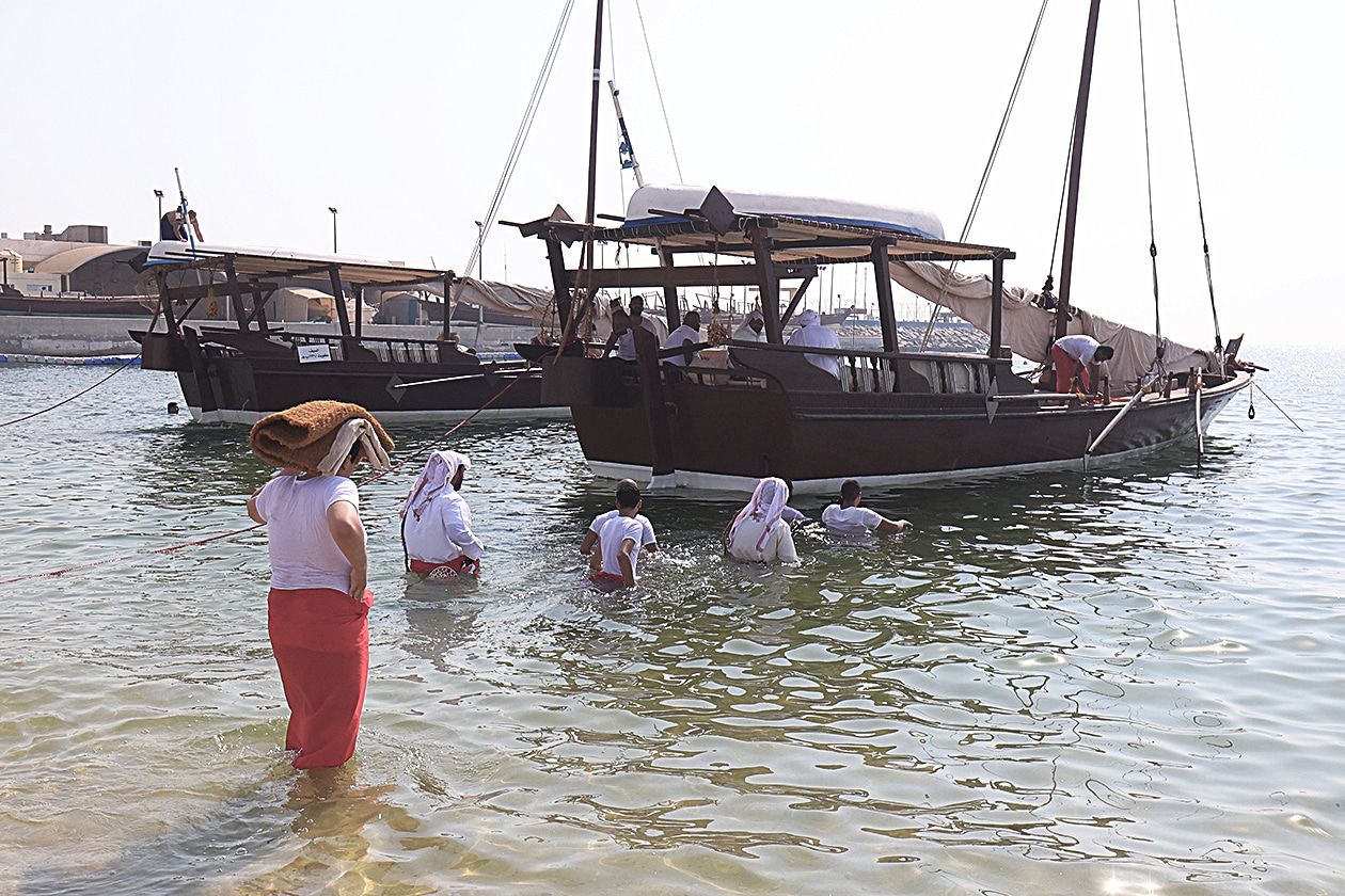 KUWAIT: Kuwaiti youths prepare to sail aboard traditional dhows for a pearl diving expedition, from the shore of Kuwait City on August 12, 2023.