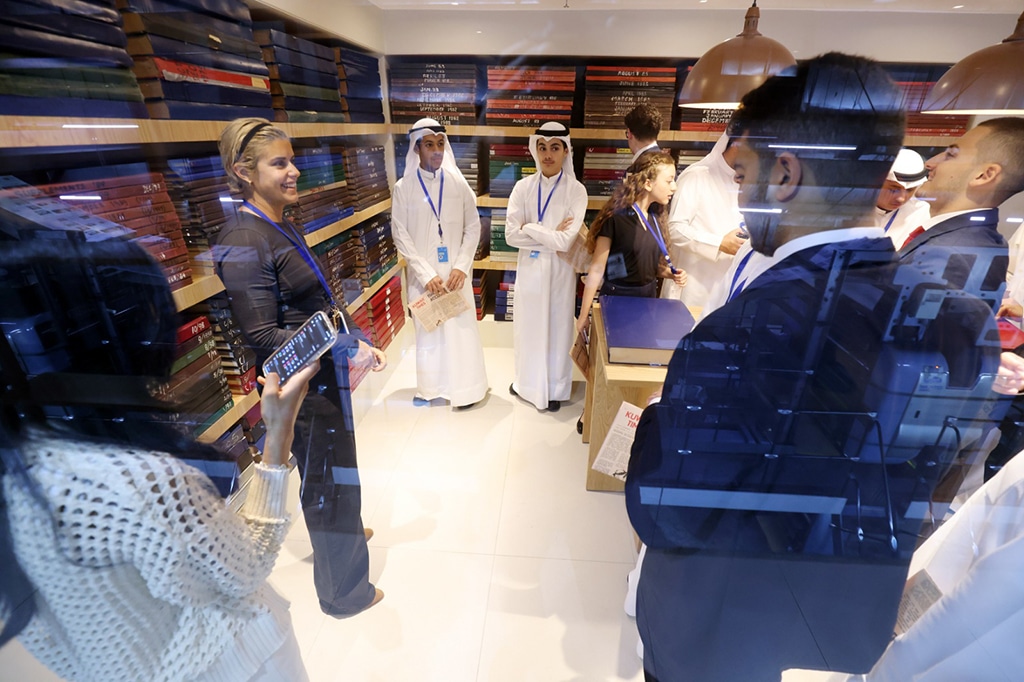 NBK students explore the archives room with Jana Alnaqeeb.