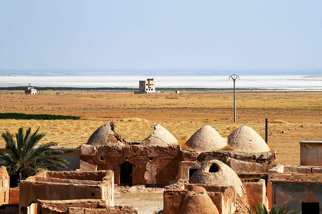 A photo shows traditional mud-brick houses known as 'beehive houses' in the village of Umm Amuda Al-Kabira in Aleppo's eastern countryside, north of Damascus.