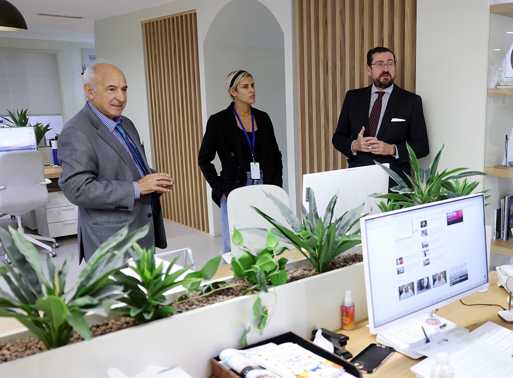 Jana Alnaqeeb shows Spanish Ambassador Miguel Aguilar and Commercial Attache Miguel Lopez the Editorial department.