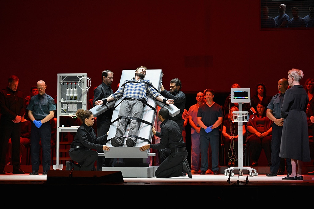 Opera singers Joyce DiDonato (right) and Ryan McKinny (center) perform during the dress rehearsal of 'Dead Man Walking'.