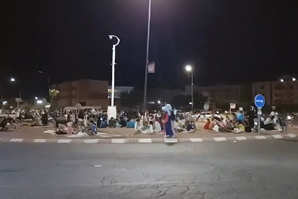 This frame grab from video footage taken by AFPTV shows people out in the open in Marrakesh September 9, 2023, following a 6.8 magnitude earthquake that struck Morocco. —  AFP