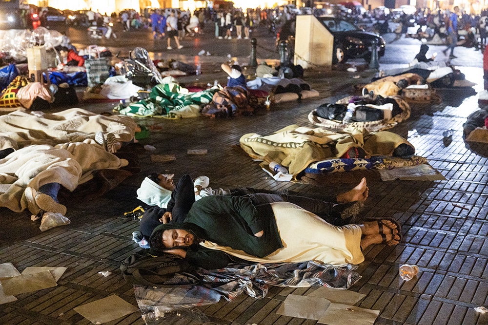 Residents take shelter ouside at a square following an earthquake in Marrakesh on September 9, 2023.— AFP