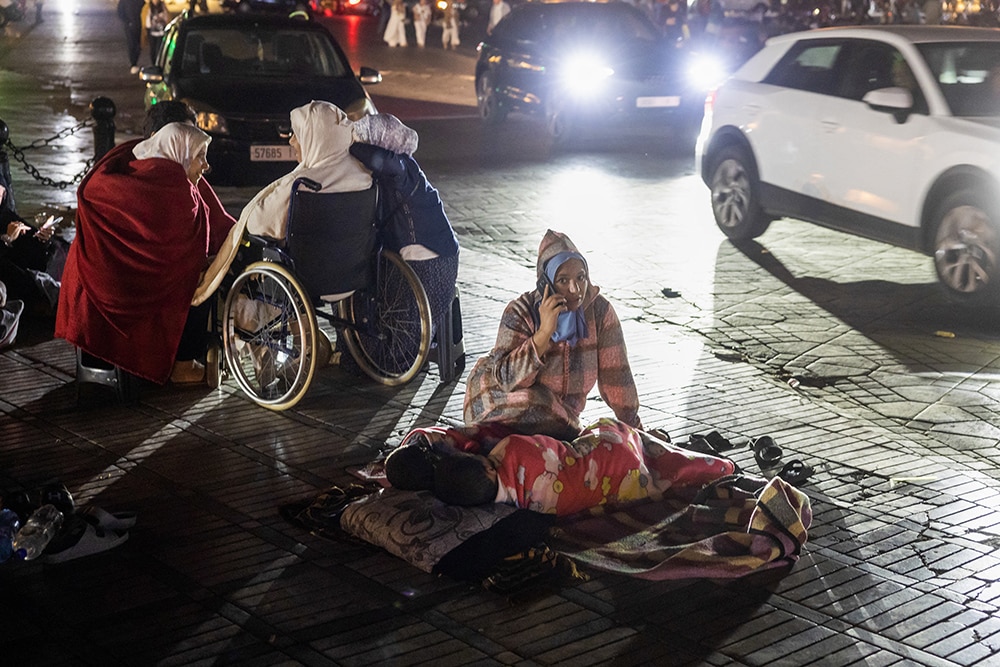 Residents take shelter ouside at a square following an earthquake in Marrakesh on September 9, 2023. —AFP