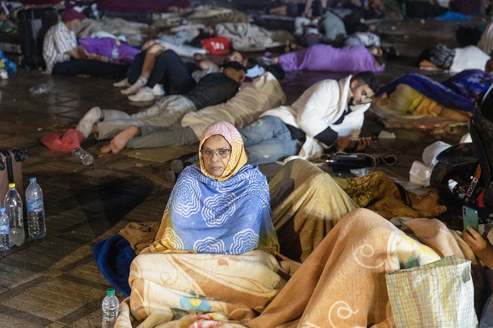 Residents take shelter ouside at a square following an earthquake in Marrakesh on September 9, 2023. — AFP