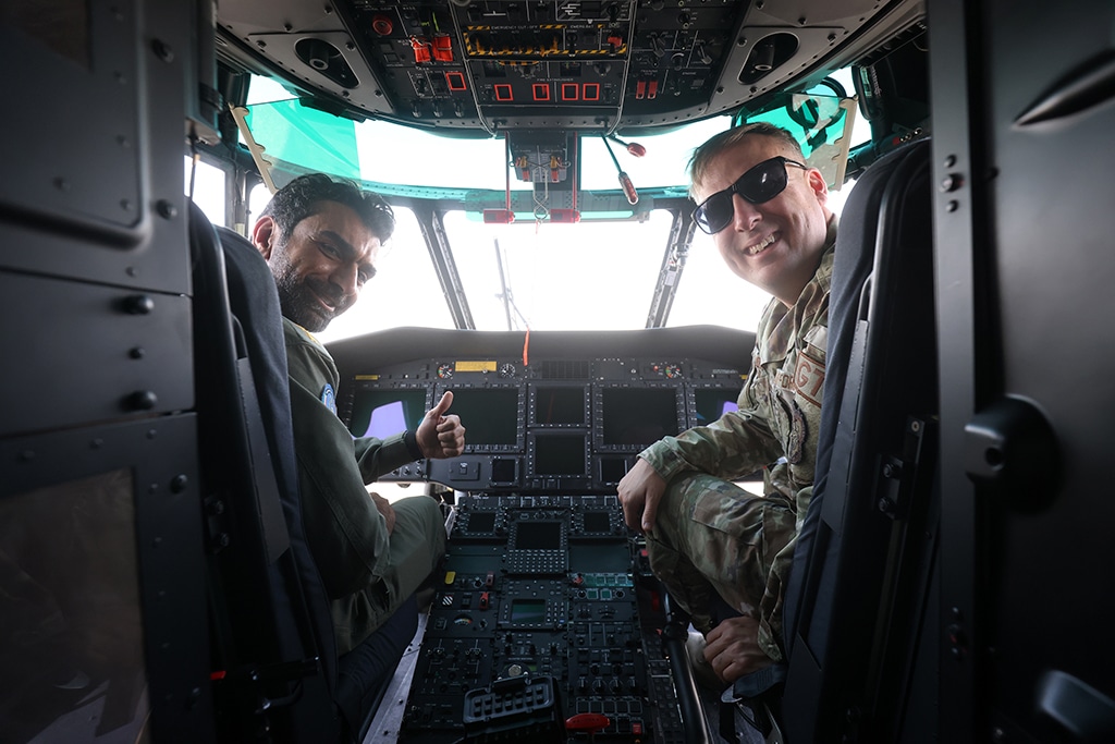 Col Abdulazeez Behbehani (Kuwait's air force) (L) MSgt Harrison Hobbs, complaints resolution manager, US air force, pictured inside Caracal 2018 plane at Ali al-Salem air base 60 km north of Kuwait City on October 2, 2013.