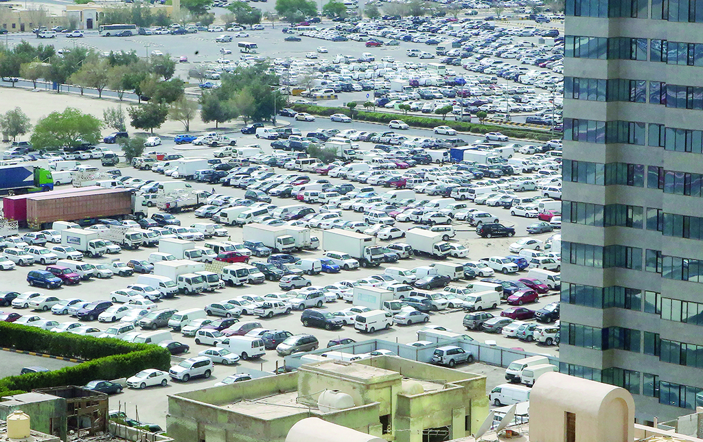 KUWAIT: A sea of vehicles are parked in a lot in Kuwait City. —  Photo by Yasser Al-Zayyat