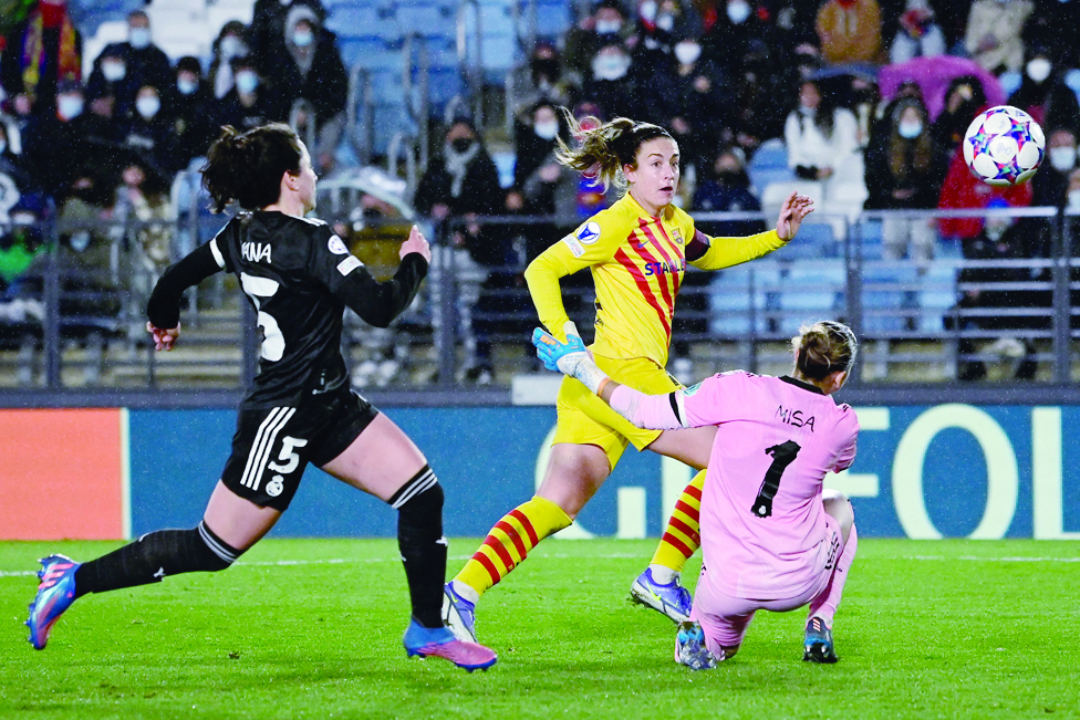 MADRID: Barcelona’s Spanish midfielder Alexia Putellas (center) scores her team’s third goal during the women’s UEFA Champions League quarter final first leg football match between Real Madrid CF and FC Barcelona on March 22, 2022. - AFP