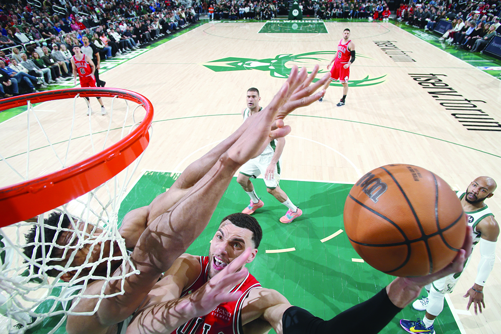 MILWAUKEE: Zach LaVine #8 of the Chicago Bulls shoots the ball during the game against the Milwaukee Bucks on March 22, 2022.- AFP